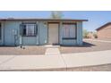 A quaint, single-story home featuring a secure front entrance with metal bars at 3646 N 67Th Ave # 12, Phoenix, AZ 85033