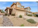 Charming two-story home with a tile roof, low maintenance landscaping, and a two-car garage at 4072 E Mountain Vista Dr, Phoenix, AZ 85048