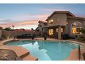 A backyard swimming pool with covered patio and ample seating, perfect for outdoor entertaining at 4072 E Mountain Vista Dr, Phoenix, AZ 85048