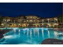 A large, brightly lit pool offers relaxation and recreation in the evening at 5350 E Deer Valley Dr # 1253, Phoenix, AZ 85054