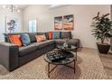 Comfortable living room featuring a plush sectional sofa and stylish decor at 5437 E Grandview Rd, Scottsdale, AZ 85254