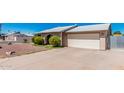 Front of house with a two-car garage and easy to care for rock yard at 716 W Nopal Pl, Chandler, AZ 85225