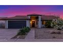 Charming single-story home with desert landscaping, inviting entryway, and attached garage, showcasing curb appeal at 756 E Appaloosa Rd, Gilbert, AZ 85296
