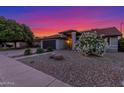 Charming single-story home featuring a lush flowering bush, desert landscaping, and attached garage, enhancing curb appeal at 756 E Appaloosa Rd, Gilbert, AZ 85296