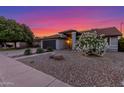 Charming single-story home with mature trees, a well-maintained lawn, and an attached two car garage at 756 E Appaloosa Rd, Gilbert, AZ 85296