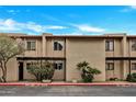 Charming townhome featuring a desert landscape, private entrances, and classic architectural details at 10631 N 15Th Way # 4, Phoenix, AZ 85020