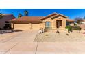 Beautiful single-Gathering home featuring a three-car garage, desert landscaping, and a cozy front porch at 1182 E Harrison St, Gilbert, AZ 85295
