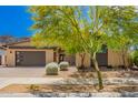 Charming single-story home features modern design, low maintenance landscaping and large garage door at 1331 E La Mirada Dr, Phoenix, AZ 85042