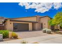 Modern single-story home with desert landscaping, and brick driveway and pathway at 1331 E La Mirada Dr, Phoenix, AZ 85042