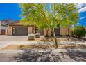Charming single-story home features modern design, low maintenance landscaping and large garage door at 1331 E La Mirada Dr, Phoenix, AZ 85042