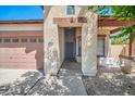 Inviting front porch with a swing and an extended overhang for shade, perfect for relaxing outdoors at 17008 W Sonora St, Goodyear, AZ 85338
