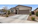 Attractive single-Gathering house with desert landscaping, a two-car garage, and a clean driveway at 1924 S 82Nd Cir, Mesa, AZ 85209