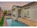 Backyard featuring a refreshing pool, covered patio, and ample space for outdoor relaxation and entertaining at 2169 N 212Th Ln, Buckeye, AZ 85396