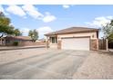 Inviting single-story residence with a neutral color palette, a two-car garage, and desert landscaping at 28321 N Zircon Dr, San Tan Valley, AZ 85143