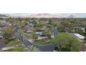 Aerial view showcases the property's location and landscaping, surrounded by lush greenery and mountain views at 345 W Gardenia Dr, Phoenix, AZ 85021