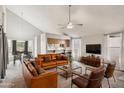 Spacious living room with vaulted ceilings and leather furniture at 3948 W Butler St, Chandler, AZ 85226