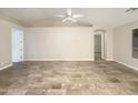 Open floor plan showcases neutral paint, tiled floor, and bright, airy ambiance at 5133 S Brice --, Mesa, AZ 85212