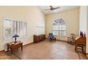 Spacious living room filled with natural light, tile flooring, and comfortable seating at 5530 E Beck Ln, Scottsdale, AZ 85254