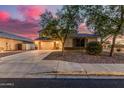 Charming single-Gathering home with a well-manicured front yard and attached two-car garage at 6804 S 45Th Gln, Laveen, AZ 85339