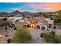 Gorgeous desert home featuring lush landscaping, desert mountains, and large garage at 7260 E Eagle Crest Dr # 10, Mesa, AZ 85207