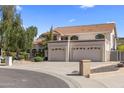 Stunning two-story home with a three-car garage, tile roof, and well-maintained landscaping at 1327 E Le Marche Ave, Phoenix, AZ 85022