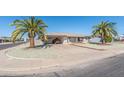 Charming single-story home with desert landscaping and a convenient covered carport at 136 N 63Rd St, Mesa, AZ 85205