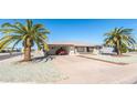 Charming single-story home with desert landscaping and a convenient covered carport at 136 N 63Rd St, Mesa, AZ 85205