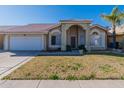 Welcoming single-story home with a well-maintained lawn, two-car garage, and neutral-colored exterior at 17402 N 45Th St, Phoenix, AZ 85032
