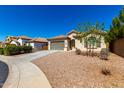 Attractive single-Gathering home featuring desert landscaping, a two-car garage, and a well-manicured front yard under a blue sky at 1980 E Horseshoe Dr, Chandler, AZ 85249