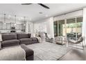 Spacious living room with a comfortable sectional sofa, modern decor, and an open layout connecting to the kitchen at 1980 E Horseshoe Dr, Chandler, AZ 85249