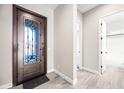 Foyer featuring decorative front door, neutral walls, tile flooring, and access to other rooms at 2040 N Dome Rock --, Mesa, AZ 85207