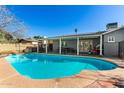 Sparkling swimming pool with patio and shaded area at 3340 W Ironwood Dr, Phoenix, AZ 85051