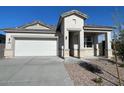 Inviting single-story home with a two-car garage and stylish stone veneer accents at 5009 S 106Th Ave, Tolleson, AZ 85353