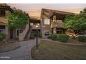 Charming exterior of a multi-level home with stucco siding and landscaped walkway at 9451 E Becker Ln # 2013, Scottsdale, AZ 85260