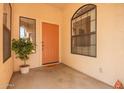 Inviting covered front porch with terra cotta tile and desert decor at 12244 N Tower Dr, Fountain Hills, AZ 85268