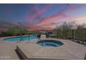 Inviting community pool and spa area with comfortable lounge chairs and scenic mountain views at 16248 E Ridgeline Dr, Fountain Hills, AZ 85268