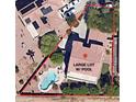Aerial view of a property showcasing a large lot with a private pool at 16291 W Crenshaw Dr, Surprise, AZ 85379