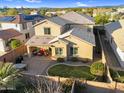 Aerial view of a two-story home with a cozy covered patio, paver patio, and well-maintained backyard at 1961 E Stacey Rd, Gilbert, AZ 85298