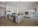 Open kitchen featuring stainless steel appliances and a large island perfect for entertaining at 3015 W Irvine Rd, Phoenix, AZ 85086