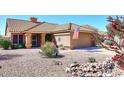 Charming home featuring a tile roof, desert landscaping, and an attached two-car garage at 4152 N Signal Cir, Mesa, AZ 85215