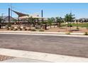 Community park showcasing a playground, covered seating, and manicured landscaping at 4927 S 106Th Ave, Tolleson, AZ 85353