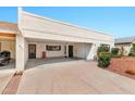 Charming single-story home with desert landscaping, an attached carport and a covered front entry at 5032 N 78Th St, Scottsdale, AZ 85250