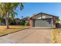 Charming single story home features a brick facade, two car garage, and drought resistant landscaping at 540 Leisure World --, Mesa, AZ 85206