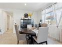 Bright dining area featuring a round table, modern chairs, and a large window at 786 W Palo Verde W Dr, Casa Grande, AZ 85122