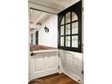Unique dutch door entrance with transom window providing natural light and farmhouse charm at 8602 E Gary Rd, Scottsdale, AZ 85260