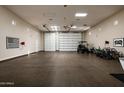 Large garage area featuring ample storage and space for recreational equipment at 8602 E Gary Rd, Scottsdale, AZ 85260
