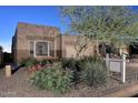 Inviting single-story home with desert landscaping and a well-manicured front yard at 9586 E Chuckwagon Ln, Scottsdale, AZ 85262