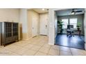 Open foyer featuring tile flooring, neutral walls, and an adjacent office space at 2185 N Beverly Pl, Buckeye, AZ 85396