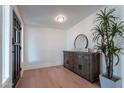 Bright foyer featuring a stylish wooden sideboard and an elegant round mirror at 291 N Washington St, Chandler, AZ 85225