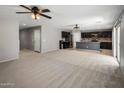 A large open-concept living room flows into the kitchen with modern appliances and a cozy atmosphere at 2929 E Binner Dr, Chandler, AZ 85225